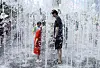 As a heat wave warning blanketed most of the country on July 27, people cooled off in the fountain at Gwanghwamun Square in central Seoul. [YONHAP]