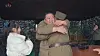 North Korean leader Kim Jong-un, center, rejoices after the regime successfully tested its Hwasong-17 intercontinental ballistic missile (ICBM) on Nov. 18 in footage recorded by the state-controlled Korean Central Television. [YONHAP]