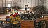 A secondhand store employee stacks chairs once used at restaurants that recently shut down due to Covid-19 at a warehouse in Ansan, Gyeonggi, on Tuesday. According to the Ministry of Employment and Labor, 647,000 food businesses were subscribed to the employment insurance program as of July, down 2.3 percent on year, meaning a decrease in operating businesses. [YONHAP]