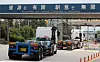 Trucks enter Posco's steel mill in Gwangyang, South Jeolla, on Wednesday as the trucker strike ends and drivers return to work. [YONHAP]