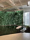 A large media wall is on display and visitors can sit on the stone chair in front of it. [LEE SUN-MIN]