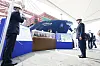 President Moon Jae-in, right, is briefed on Korea's trade at an event celebrating the departure of HMM’s Hanul container ship from Busan to Europe at the Busan New Port on Tuesday. [YONHAP]