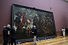 A chief technician, left, is congratulated after successfully moving the 'Baptism of Christ', by Baroque painter Peter Paul Rubens inside a gallery at the Royal Museum of Fine Arts Antwerp in Antwerp, Belgium, on March 15. Moving a masterpiece is never easy, even more-so when it measures 4.11 by 6.75 meters (13.5 feet by 22.1 feet) and weighs 560 kilograms (1,225 pounds). The Rubens painting is the first to be moved back into its gallery hall after a decade long renovation of the museum which will open in September. [AP/YONHAP]