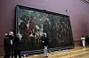 A chief technician, left, is congratulated after successfully moving the 'Baptism of Christ', by Baroque painter Peter Paul Rubens inside a gallery at the Royal Museum of Fine Arts Antwerp in Antwerp, Belgium, on March 15. Moving a masterpiece is never easy, even more-so when it measures 4.11 by 6.75 meters (13.5 feet by 22.1 feet) and weighs 560 kilograms (1,225 pounds). The Rubens painting is the first to be moved back into its gallery hall after a decade long renovation of the museum which will open in September. [AP/YONHAP]