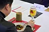 A participant tries chef Lee Jun's cheese, oxtail and pecans and chef Lee Chan-yang's cavatelli and potato on Feb. 3 at the Stella Artois event in southern Seoul. [STELLA ARTOIS]
