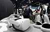An employee demonstrates an artificial intelligence (AI)-backed device at AI Expo Korea 2021 held in Coex, southern Seoul on Wednesday. The event will run through March 26. [YONHAP]