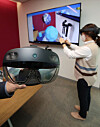 A participant tries on Microsoft’s HoloLens 2 at Microsoft Korea's office in Jongno District, central Seoul, on Monday during an online press conference for the product’s release in Korea. The price of the mixed reality (MR) device, which is a wearable holographic computer suited to corporations, is estimated to be between 5.5 million won ($4,845) and 5.8 million won. [YONHAP]