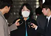 Lawmaker Yoon Mee-hyang responds to questions from the press in front of Seoul High Court in southern Seoul on Wednesday after the court convicted her of embezzling donations meant to support victims of the Japanese military's wartime sexual slavery. [YONHAP]