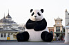 A 12-meter (39 feet) panda, 'Giant Bao,' stands in front of Everland's main entrance on Thursday in Yongin, Gyeonggi, greeting visitors with its warm and tranquil smile. The theme park said it installed 'Giant Bao' on Dec. 7, which became a must-see for visitors. The inflatable velvet panda balloon was brought in as part of Everland's winter festival, 'Bao Family in Wintertopia.'[EVERLAND]
