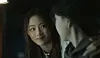 In the final scene of NewJeans' latest music video 'OMG,' member Minji, dressed as a psychiatric doctor, approaches a woman typing a critical comment toward NewJeans’ producers online. Minji tells the woman, “Let’s go,” implying that critical commenters are “mentally ill.” [ADOR]