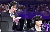Korean League of Legends coach Kim ″kkOma″ Jung-gyun stands behind player Jeong ″Chovy″ Ji-hoon during the final match against Chinese Taipei at the Hangzhou Asian Games in September. [YONHAP]