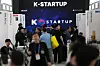 Visitors walk near a booth for Korean startups at the CES tech show is set up at the Venetian Expo in Las Vegas, Nevada, on Jan. 7. [YONHAP]