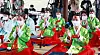 Young people dressed in hanbok, or traditional Korean attire, who have reached the age of adulthood, clap during a ceremony to mark the 49th anniversary of the Coming-of-age Day at the Hanok Village in Jung District, central Seoul, on Monday. [NEWS1]
