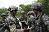 Korean and American soldiers shake hands during a joint drill at the Korea Combat Training Center in Inje, Gangwon, on Wednesday. [YONHAP]