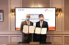 Ahn Jae-yong, CEO of SK Bioscience, right, and Richard Hatchett, CEO of the Coalition for Epidemic Preparedness Innovations, pose for a photo after signing an agreement to extend the capacity reservation contract for another year on Oct. 5. [SK BIOSCIENCE]