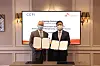 Ahn Jae-yong, CEO of SK Bioscience, right, and Richard Hatchett, CEO of the Coalition for Epidemic Preparedness Innovations, pose for a photo after signing an agreement to extend the capacity reservation contract for another year on Oct. 5. [SK BIOSCIENCE]