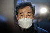 Ruling Democratic Party Chairman Lee Nak-yon answers questions from the press upon exiting the party's Supreme Council meeting at the National Assembly in Seoul on Sunday. [NEWS1]