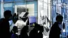 Passengers pass by a Samsung Electronics retail shop in Seoul. [NEWS1]