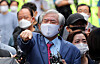 Rev. Jun Kwang-hoon speaks to reporters Monday afternoon outside his home in Seongbuk District, central Seoul, shortly before taking a police vehicle to the Seoul Detention Center. [NEWS1]