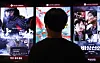 A moviegoer looks at posters at Lotte Cinema's branch in Lotte World Tower at Songpa District, southern Seoul. [NEWS1]