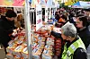 People look at products for sale at a Red Cross charity market at the Shade Tree Square at Busan City Hall on Thursday. [YONHAP]