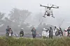 Members of the KT DMZ Ecological Conservation Group use drones to feed migratory birds on Thursday. [KT]