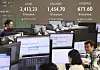 The Kospi, won to dollar exchange rate and Kosdaq are seen on the boards at Hana Bank Headquarters in central Seoul on the morning of April 10. [YONHAP]