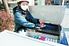 A young Fresh Manager, the job title for sellers of the Korean Yakurt products, arranges dairy goods on her mobile refrigerated cart [HY]