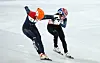 Choi Min-jeong, right, crosses the finish line second, 0.052 seconds behind gold medalist Suzanne Schulting of the Netherlands in the women's 1,000-meter final at the Capital Indoor Stadium on Friday. [YONHAP]