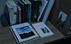 The images seen from the desk of a policeman’s missing brother show “The Empire of Light” by Rene Magritte. [NETFLIX]