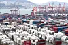 Containers being loaded at a port in Busan on Wednesday [YONHAP]