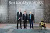From left, Boston Dynamics Chief Legal Officer Jason Fiorillo, Industry Minister Lee Chang-yang and Boston Dynamics founder Marc Raibert pose for a photo in front of the company logo on Friday. [BOSTON DYNAMICS]