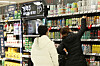Customers pick beer off a shelf at Emart in Yongsan, Seoul on Tuesday. Beer sales at discount marts surged as lives have been restricted due to Covid-19 social distancing regulations. According to Emart, beer sales last year has jumped 150 percent. In January, they were up 230 percent. [YONHAP]