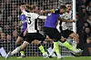 Tottenham Hotspur's Harry Kane shoots to score the opening goal of a Premier League match between Fulham and Tottenham Hotspur at Craven Cottage in London on Sunday. [AFP/YONHAP]