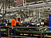 Workers and robots work at Volvo Cars’ Torslanda manufacturing plant in Gothenburg, Sweden, on Dec. 5. [SARAH CHEA]