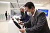 U.S. President Joe Biden, left, and Korean President Yoon Suk-yeol, right, sign their names on 3-nanometer wafers while visiting the Samsung Electronics chip plant in Pyeongtaek on May 20. [YONHAP]