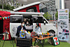 Models pose in front of a camping car displayed at 7-Eleven's headquarters in Jung District, central Seoul on Tuesday. The convenience store said it is selling two camping car models in collaboration with Bayrun RV Group, a Korean RV company that officially launched in March. The camping car, which is a remodeled Kia Ray, retails at 29.15 million won ($26,000), while the larger Bayrun 640 RV is sold for 76.5 million won. [YONHAP]