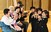 Children from the Gu-am Pani Pani Daycare Center make finger hearts after presenting older adults with carnations at the La Domus Art Center in Yuseong District, western Daejeon, on Tuesday, the day before Parents’ Day. [NEWS1]