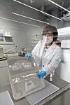 An Iope Lab employee holds up the 3-D printed sheet masks. [AMOREPACIFIC]
