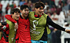 Song Bum-keun, right, celebrates alongside Son Heung-min, center and Lee Jae-sung at the end of the Qatar 2022 World Cup Group H match between Korea and Portugal at Education City Stadium in Al-Rayyan, Qatar on Dec. 3.  [YONHAP]