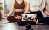 Yoga classes streamed online via a smartphone. [SHUTTERSTOCK]