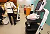 This file photo taken on Dec. 12, 2023, shows a service robot under demonstration during a convention held in Seoul. [YONHAP]