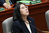 Minister of Gender Equality and Family Kim Hyun-sook looks up as she attends a plenary session of the parliamentary Special Committee on Budget and Accounts at the National Assembly in Yeouido, western Seoul, Wednesday. She made her first apology for the poor management of the World Scout Jamboree. [YONHAP]