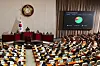 Lawmakers pass a bill for pension reform during a plenary session at the National Assembly in western Seoul on March 20. [NEWS1]