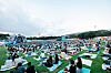 Festivalgoers at The Beautiful Mint Life 2021 music festival watch performances on picnic mats Saturday at Olympic Park in southern Seoul. The Beautiful Mint Life 2021 is Korea's first large-scale outdoor music festival to be held in a year and eight months since the Covid-19 pandemic broke out early last year. All visitors must use a self-testing kit to help ensure they do not have the virus. [NEWS1]