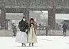 Tourists in hanbok walk in a snowy Gyeongbok Palace in central Seoul on Thursday. [NEWS1]