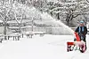 A man clearing the snow in front of a youth center in Suwon, Gyeonggi, on Thursday afternoon. [YONHAP]