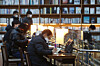 People wearing masks spend time at a bookstore in Seoul on Monday. [YONHAP]