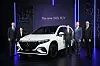 Officials from Mercedes-Benz Korea including Vice Presidents Johannes Schoen, far left, and Lee Sang-kuk, third from left, take a photo with the EQS SUV at a press conference on Wednesday. [MERCEDES-BENZ KOREA]