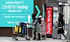 Arrivals from China walk out of a Covid-19 testing center at Incheon International Airport on Sunday. [NEWS1]